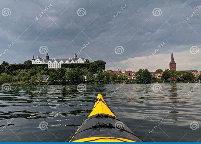 Plön castle Ploen, Germany, Yellow Kayak on Great Ploner Ploener Lake in ... photo